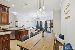 Corinth house for rent - A kitchen with a dining table and chairs in the foreground.