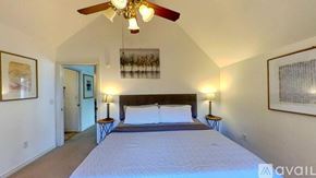 San Marcos apartment for rent - A bedroom with a large bed and a ceiling fan.