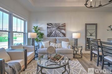 Jonesborough apartment for rent - A living room with a glass table and a couch.