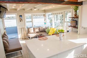 San Diego condo for rent - A living room with a white countertop and a brown couch.