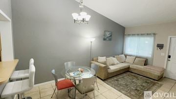 Pembroke Pines apartment for rent - A living room with a dining table and chairs.