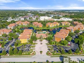 Sarasota condo for rent - A bird's eye view of a community with a large central green space and houses surrounding it.