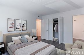 Newport News apartment for rent - A bedroom with a large bed and a couch.