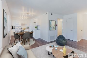 Newport News apartment for rent - A modern living room with a dining table and chairs.
