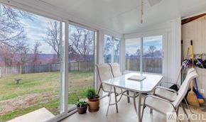 Fort Washington house for rent - A sunny patio with a table and chairs.