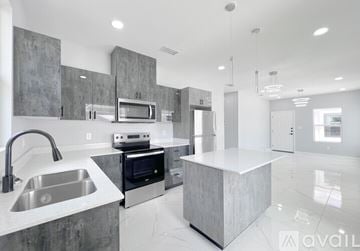 Edinburg apartment for rent - A modern kitchen with a stainless steel sink and countertop.