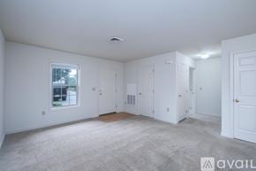 Mountville apartment for rent - A sunny room with a large window and a door.