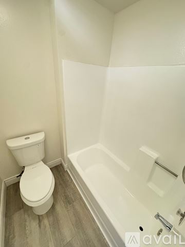 Azusa apartment for rent - A kitchen with white cabinets and appliances.