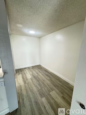 Azusa apartment for rent - A large outdoor swimming pool with a house in the background.