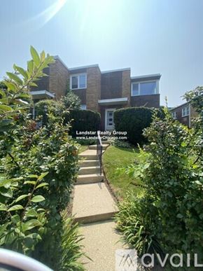 Highland Park apartment for rent - A residential area with a house and a sign for Landstar Realty Group.