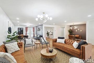 Dallas house for rent - A living room with a brown sofa and a coffee table.