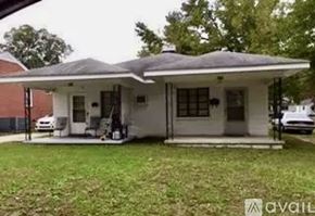Rocky Mount apartment for rent - A house with a white front porch and a covered patio area.