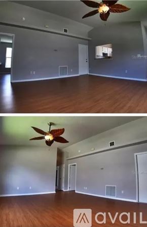 Winter Garden house for rent - A room with a ceiling fan and wooden floors.
