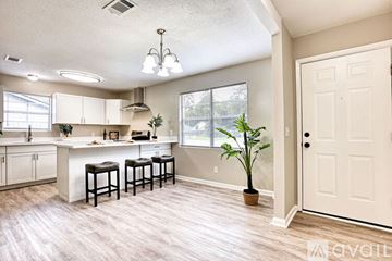 Hinesville apartment for rent - A kitchen with white cabinets and a white counter top.