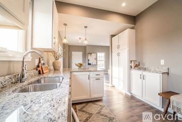 Columbiana house for rent - A kitchen with a stainless steel refrigerator, oven, and microwave.