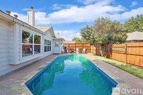 Saginaw house for rent - A backyard with a pool and a house.