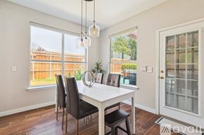 Lake Dallas house for rent - A dining room with a table and chairs.