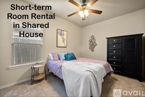 Wolfforth apartment for rent - A bedroom with a bed, a ceiling fan, and a cabinet is available for short-term room rental in a shared house.