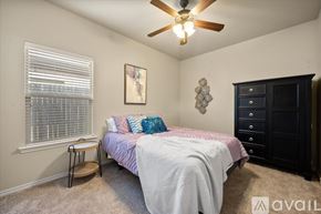 Wolfforth apartment for rent - A bedroom with a bed, dresser, and window.