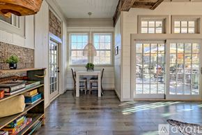 Clayton house for rent - A dining room with a table and chairs is shown.