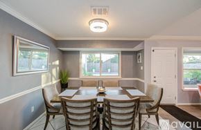 Houston house for rent - A dining room with a table set for six.