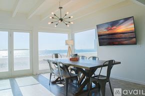 Huntington Beach condo for rent - A dining room with a view of the beach.
