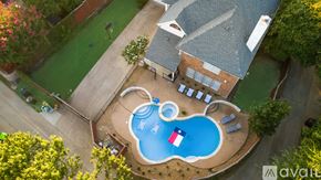 Plano apartment for rent - A backyard with a pool and a house.