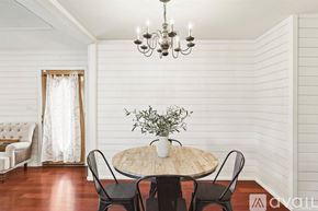 Mckinney house for rent - A dining room with a round table and chairs.