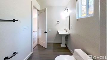 San Marcos house for rent - A kitchen with white cabinets and a wooden countertop.