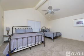 San Marcos apartment for rent - A bedroom with two beds and a ceiling fan.