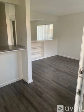 Bakersfield apartment for rent - A room with a white wall and a grey floor.