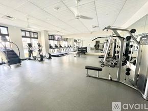 Lewisville apartment for rent - A gym with a variety of equipment including treadmills, weights, and exercise machines.