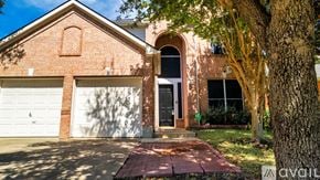 Irving apartment for rent - A house with a brick facade and a white garage door.