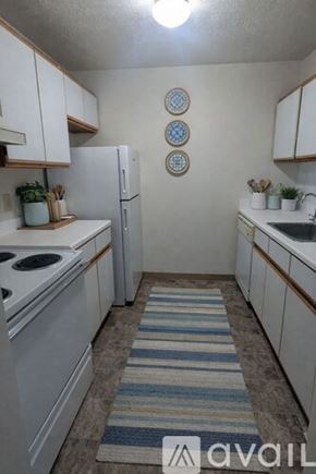 Monroe apartment for rent - A living room with a sofa, armchair, and television.