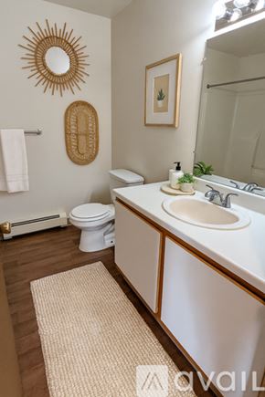 Monroe apartment for rent - A bedroom with a bed, a dresser, and a wardrobe.