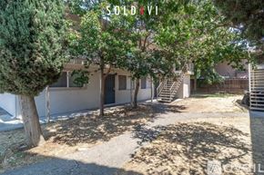 Merced apartment for rent - A room with tiled flooring and a window with blinds.