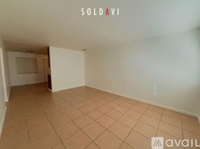 Merced apartment for rent - A room with a white door and a window with blinds.