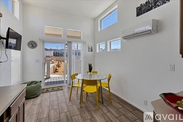 Barstow apartment for rent - A living room with a yellow table and chairs.