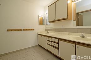 St Cloud apartment for rent - A room with a tiled floor and a wall.