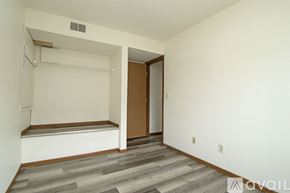 St Cloud apartment for rent - A carpeted room with a sliding glass door leading to a balcony.