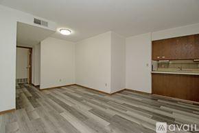 St Cloud apartment for rent - A bedroom with a brown door and a white wall.