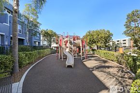 San Diego condo for rent - A playground with a slide and a climbing frame.