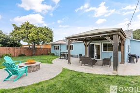 San Diego house for rent - A blue house with a covered patio and outdoor furniture.