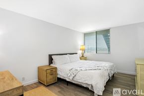 Imperial Beach condo for rent - A bedroom with a bed, nightstand, and window with blinds.