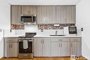 San Diego apartment for rent - A bedroom with a bed, dresser, and television.