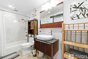 San Diego apartment for rent - A swimming pool surrounded by palm trees and lounge chairs.