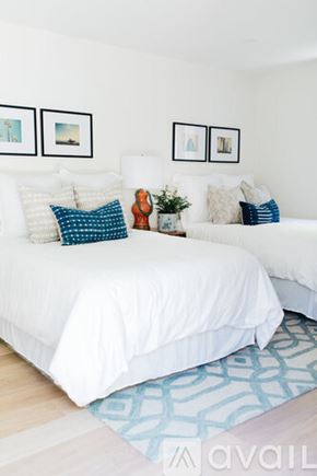 Laguna Beach house for rent - A bedroom with two beds and a rug.