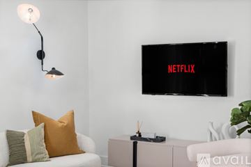 Dallas apartment for rent - A living room with a Netflix branded television mounted on the wall.