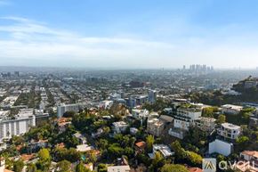 West Hollywood apartment for rent - A modern kitchen with wooden cabinets and stainless steel appliances.