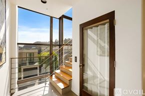 West Hollywood apartment for rent - A bedroom with a large bed and a television on the wall.